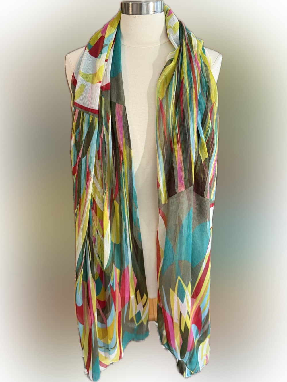 This vibrant Storiatipic lightweight scarf features a colorful abstrac.